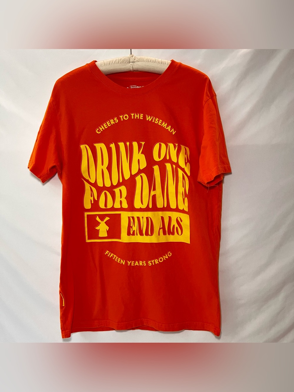 Dutch Bros “Drink One For Dane” Orange Tshirt. Size Large.